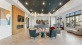 a clubroom with a tv, chairs and a couch