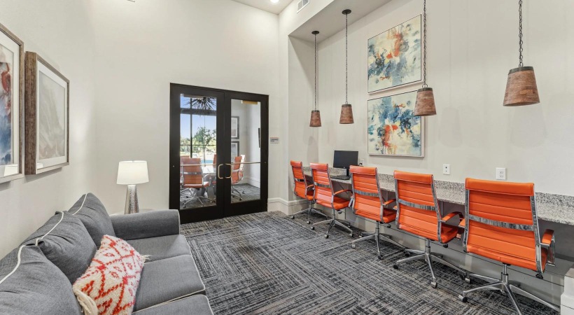 a community office room with a couch and chairs