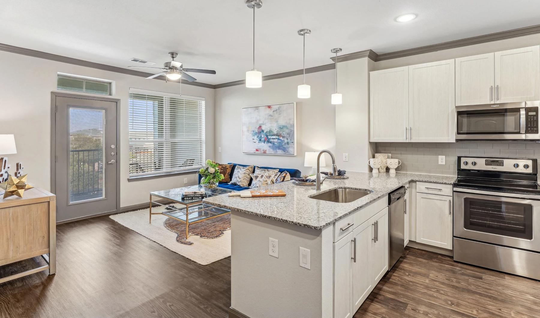a kitchen with a couch and a table